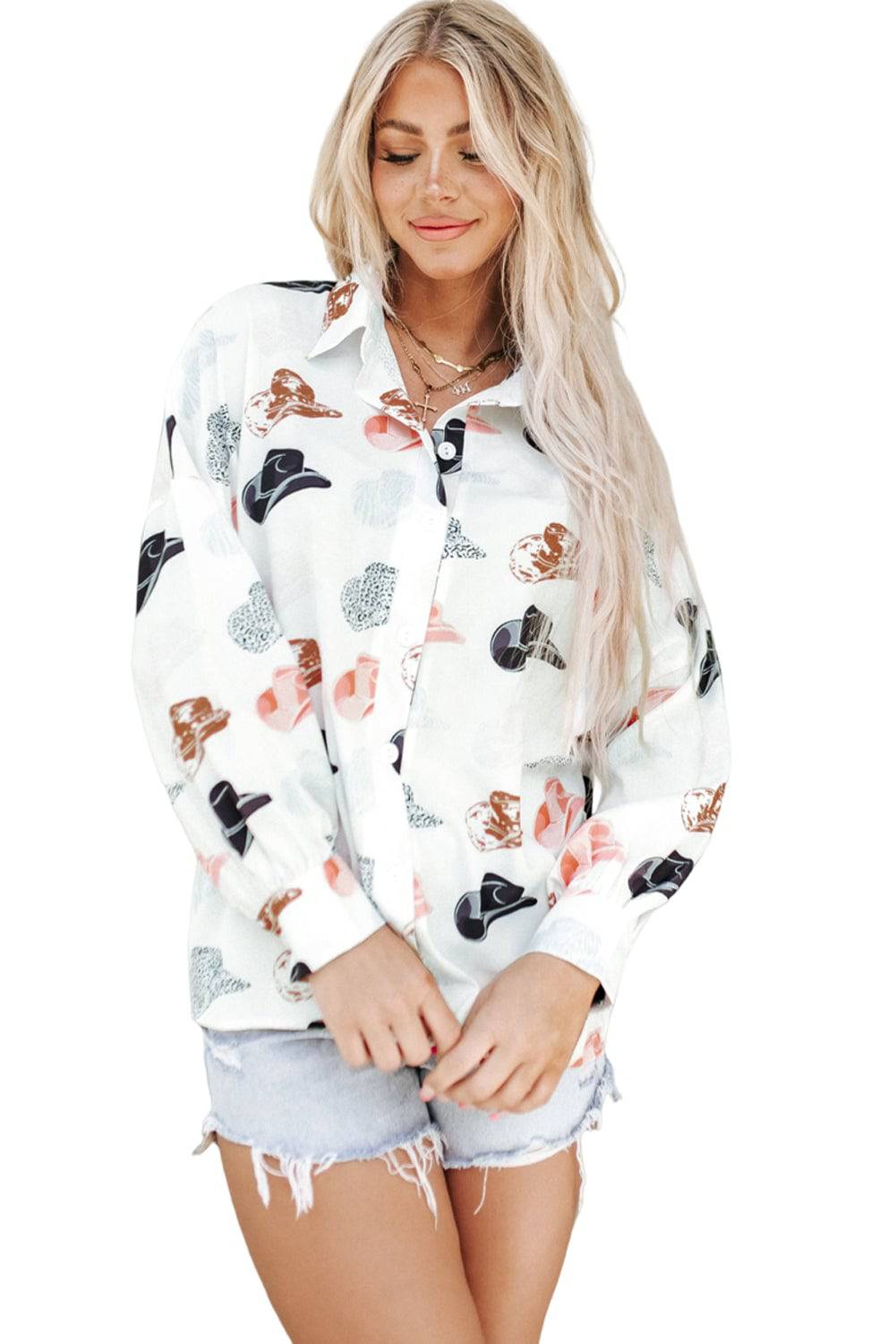 White cowboy hat and puff sleeve button-up shirt by eprolo, featuring a classic Western style and detailed design.
