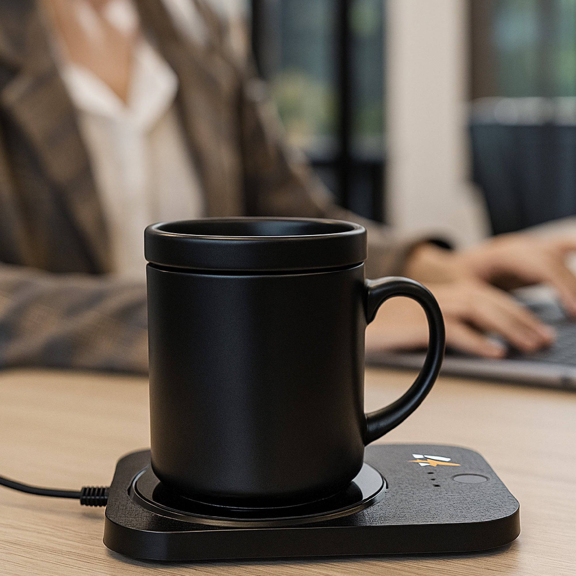 Pursonic Sip & Charge 2-in-1 wireless charger and mug warmer on a desk, showing the sleek electronic device in use.