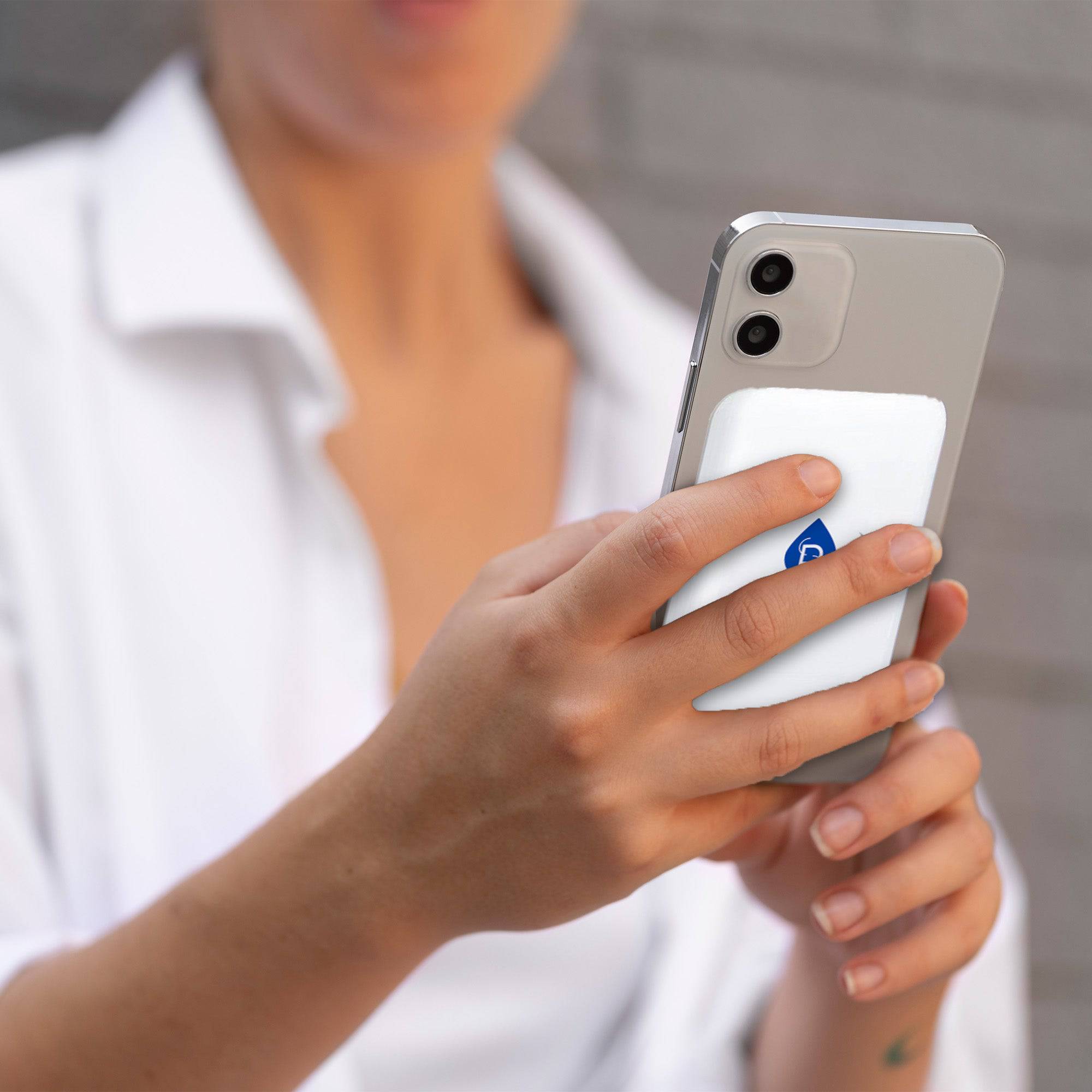 Pursonic Magnetic Wireless Power Bank in use, showcasing portable design and effortless charging capabilities in a lifestyle setting.